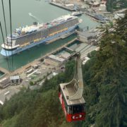 Goldbelt tram car rising above the juneau waterfront including a cruise ship